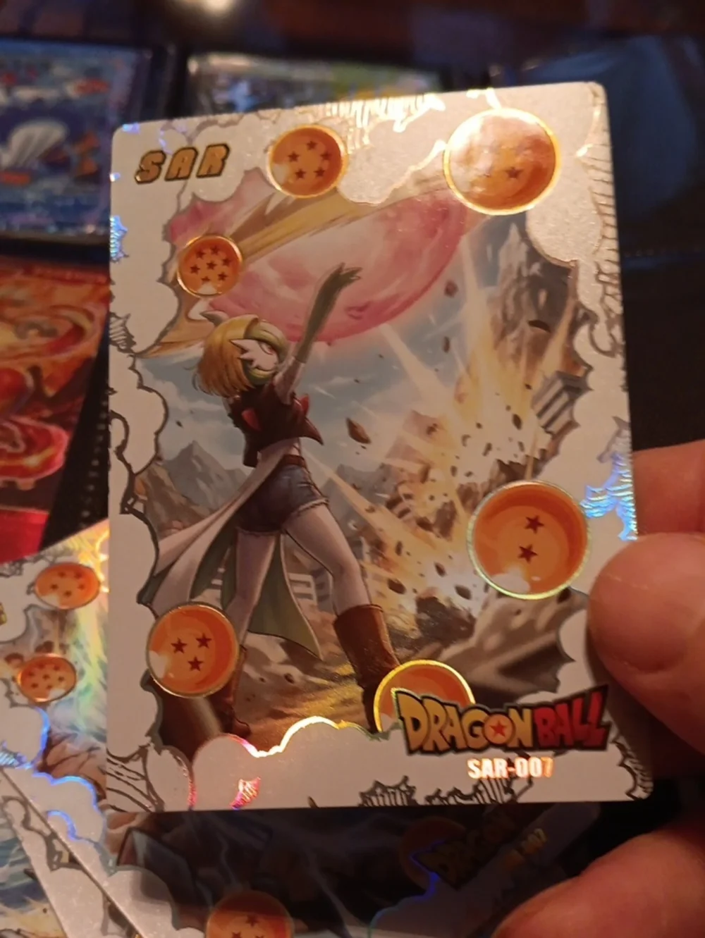 Pokemon Dragon Ball Holographic Card with Gold and Orange Accents